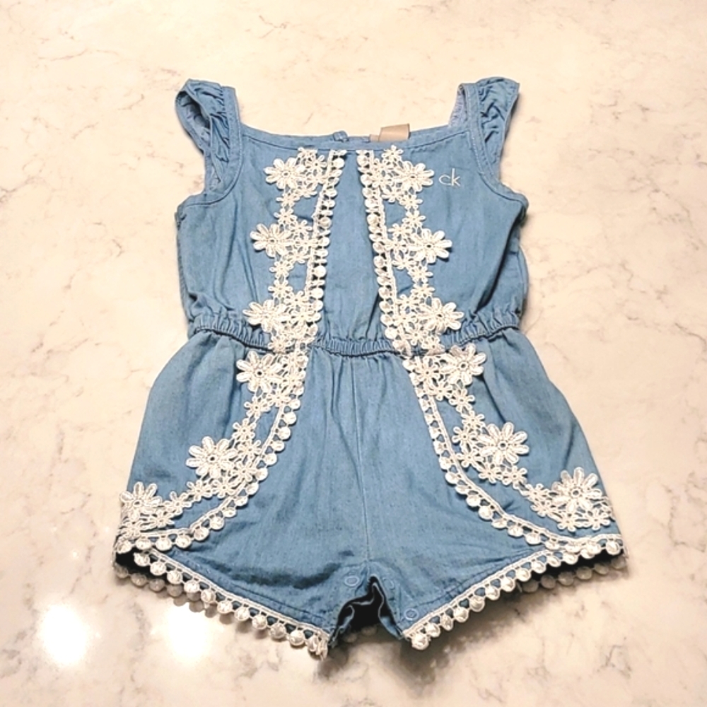 CALVIN KLEIN ROMPER SIZE 24 MONTHS.  DENIM BLUE WITH WHITE APPLIQUES